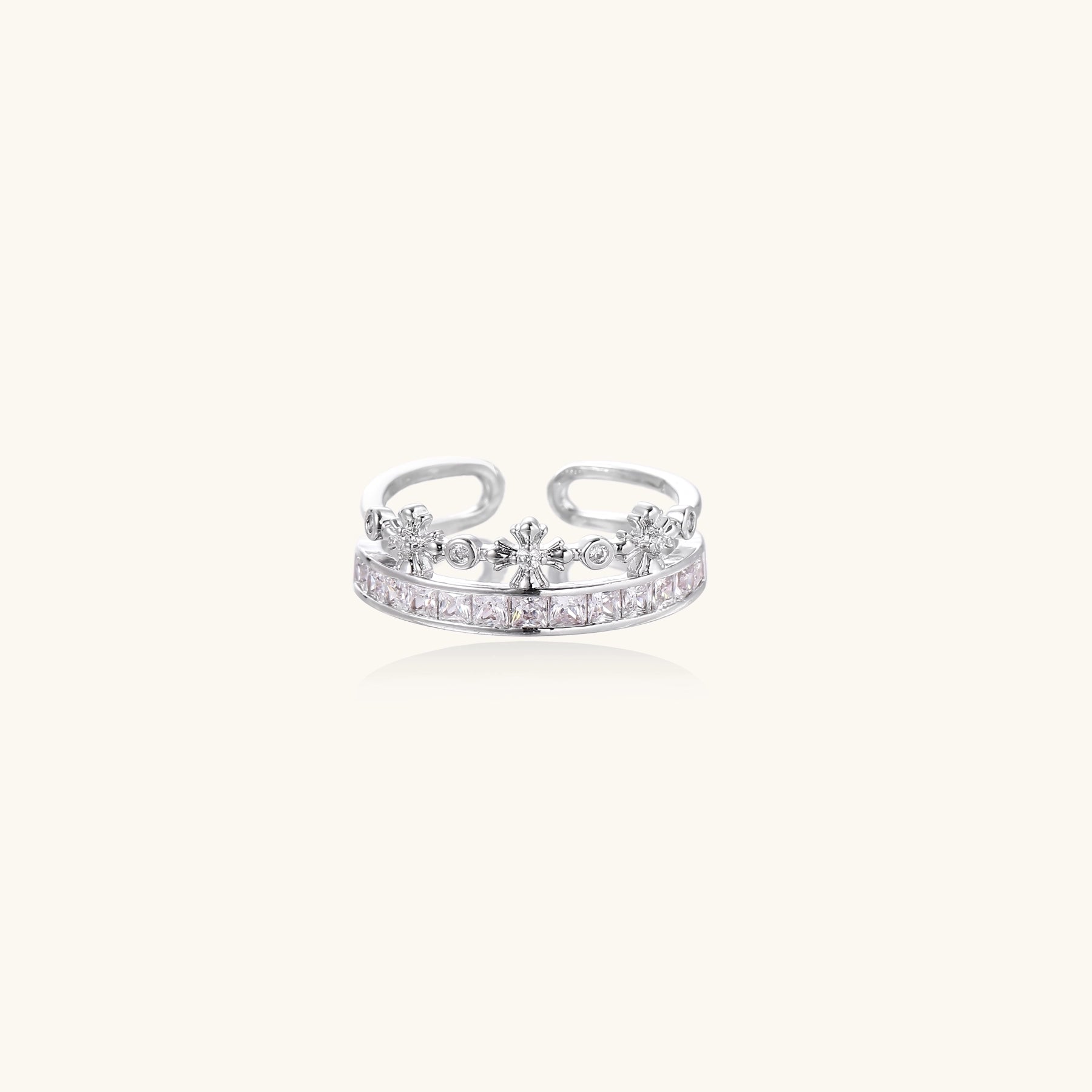 Adjustable gold-plated crown ring with zirconia crystals in ornate tiara design on white background.