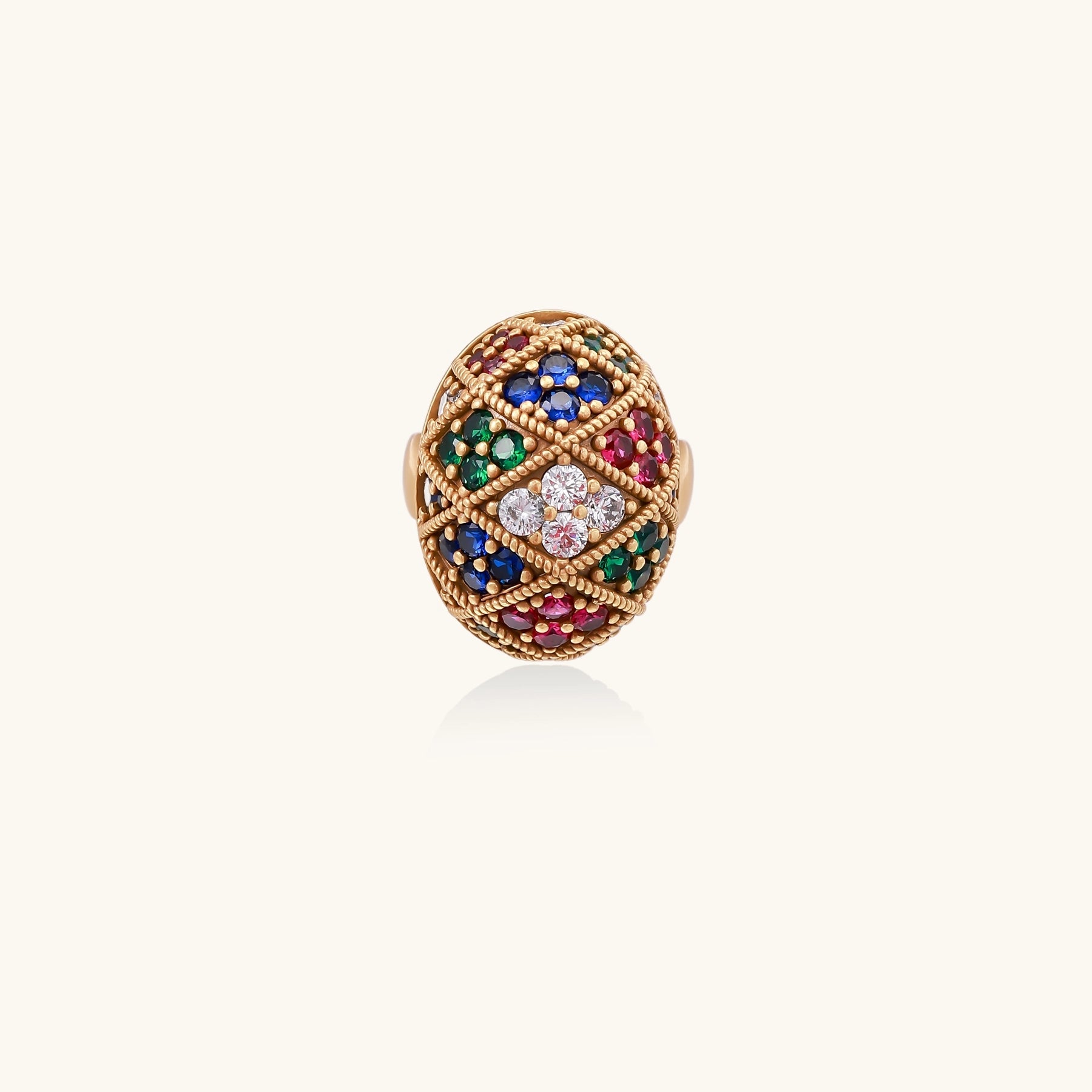 Domed gold-plated ring with geometric mosaic pattern featuring blue, green, red and clear zirconia stones in diamond settings
