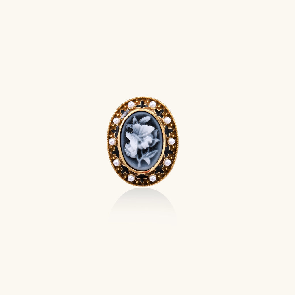Oval cameo ring with blue-grey floral design surrounded by white shell pearls in gold-plated brass setting